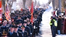 Thousands of firefighters from across Canada march through the streets of Listowel, Ont., to honour fallen fire fighters Ken Rea and Ray Walter on Thursday, March 24, 2011. (Geoff Robins / THE CANADIAN PRESS)