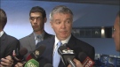 Coun. Paul Ainslie is shown speaking with reporters at city hall on Thursday, May 23, 2013.