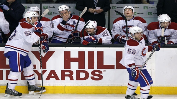 Montreal Canadiens players react on the bench after a goal by the Boston Bruins during the third period of an NHL hockey game in Boston Thursday, March 24, 2011. The Bruins won 7-0. (AP Photo/Elise Amendola)
