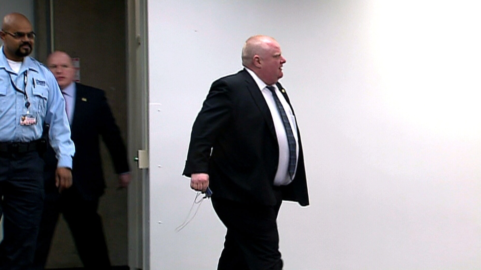 Toronto Mayor Rob Ford rushes past reporters