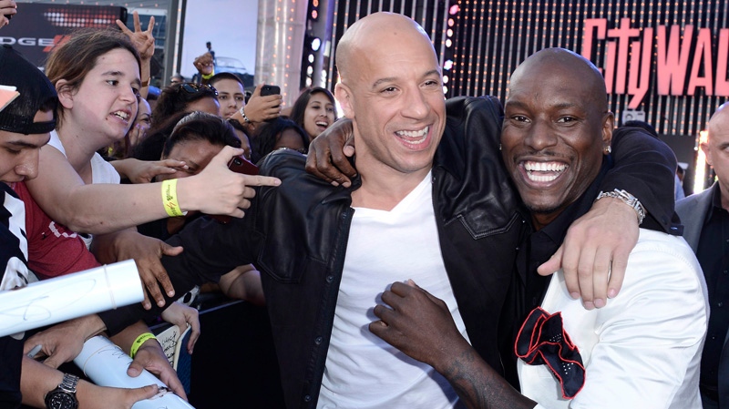 Actor Vin Diesel, left, and actor Tyrese Gibson embrace at the LA Premiere ...