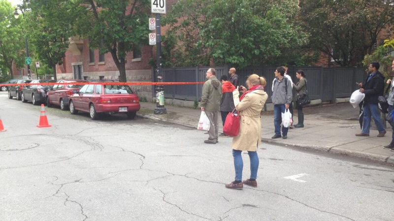 Police prevented people from entering an area around Hutchison and Durocher on Sunday afternoon after getting reports of a man carrying a rifle on May 26, 2013. (CTV Montreal/Cosmo Santamaria)