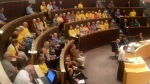 Supporters of the Rockway Centre, wearing yellow T-shirts, sit in Kitchener council chambers on Monday, May 27, 2013. (Ashley Cross / CTV Kitchener)
