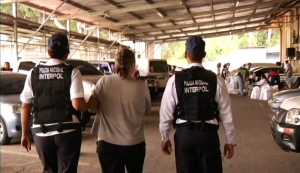 Pamela Porter is led away in handcuffs on Monday May 27, 2013. 