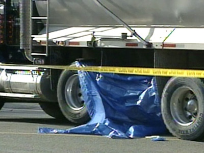 A pedestrian was struck and killed by a garbage truck while crossing the street to catch a bus.