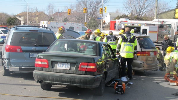 Firefighters work to free a five-year-old girl from a minivan that was T-boned, Sunday, March 27, 2011. The girl died from her injuries in hospital the following day.
