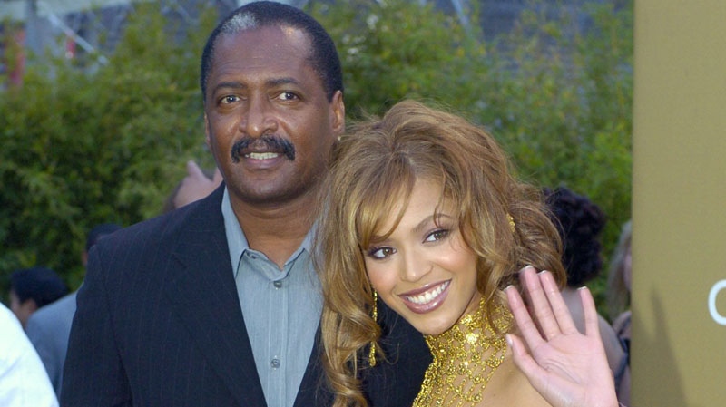 Singer Beyonce Knowles arrives at the 46th Annual Grammy Awards with her father and manager Mathew Knowles in Los Angeles, Feb. 8, 2004. (AP / Mark J. Terrill) 