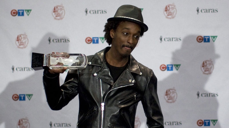 K'Naan poses with his trophy for single of the year at the Juno Awards in Toronto on Sunday March 27, 2011. (THE CANADIAN PRESS/Chris Young)