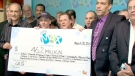 Group of 24 Bombardier workers receive a portion of a disputed $50 million lottery jackpot at OLG office in Toronto, Wednesday, March 30, 2011.