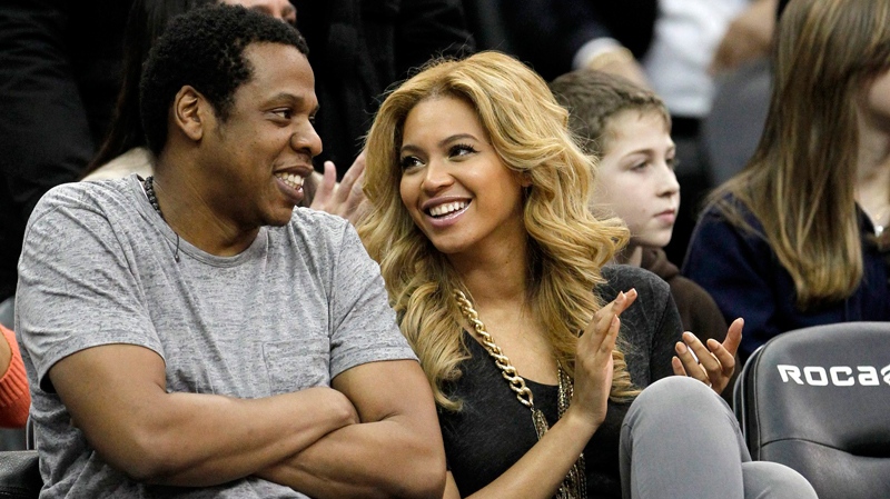 New Jersey Nets' minority owner Jay-Z and Beyonce Knowles sit courtside during an NBA basketball game between the Nets and the Phoenix Suns, Monday, Feb. 28, 2011, in Newark, N.J. (AP / Julio Cortez)