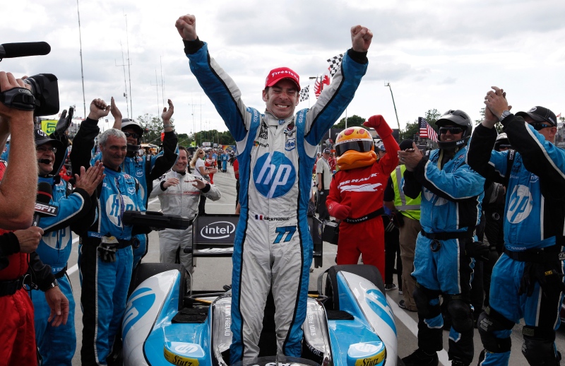 Simon Pagenaud, of France, celebrates his victory in the IndyCar Detroit Grand Prix auto race on Belle Isle in Detroit on June 2, 2013. (AP Photo/Paul Sancya)