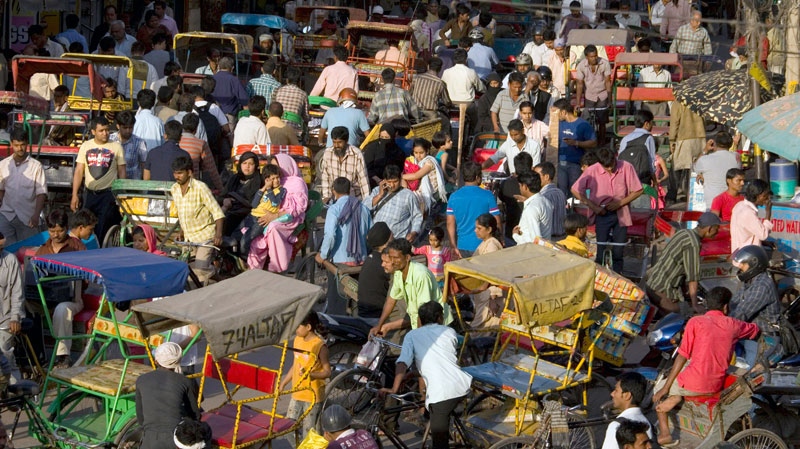 People crowd a market area in New Delhi, India, Thursday, March 31, 2011. (AP / Manish Swarup)