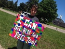 Anthony Aquino, 12, holds up a sign while protesting in Windsor, Ont., on Monday, June 3, 2013. (Gina Chung / CTV Windsor)