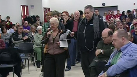 Concerned citizens line up to speak at a public consultation meeting on OC Transpo route changes, Wednesday, March 31, 2011.