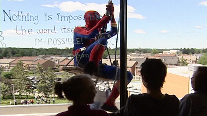 Spiderman used his wall-crawling skills to wash windows at CHEO, much to the delight of the children inside.