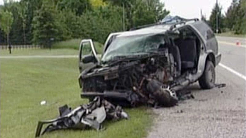 A damaged SUV is seen following a collision on Elgin Road northeast of Dorchester, Ont. on Wednesday, June 5, 2013.