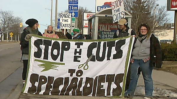 Protesters take part in the 'Day of Action Against Poverty' in Kitchener, Ont. on Friday, April 1, 2011.