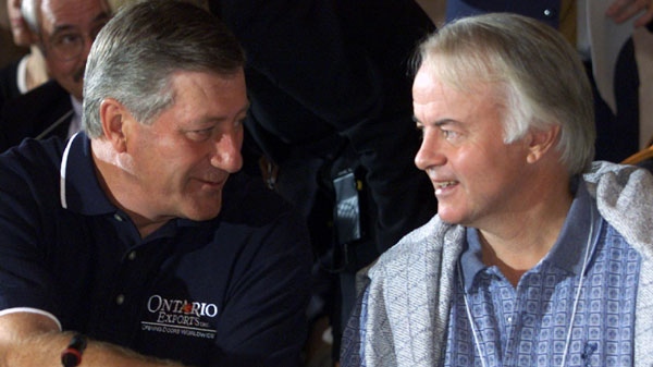 Former Ontario Premier Mike Harris with Conservative MPP Norm Sterling on Thursday Aug. 10, 2000.(CP PHOTO/Adrian Wyld)