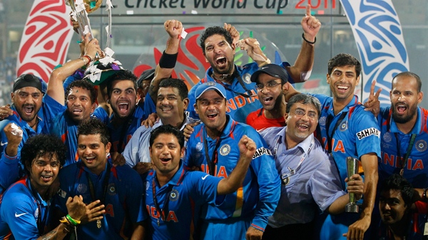 India's players celebrate with the trophy after winning the Cricket World Cup final between India and Sri Lanka in Mumbai, India, Saturday, April 2, 2011. (AP / Kirsty Wigglesworth)