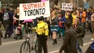 A large group of protesters walked the streets of Toronto towards Toronto Police headquarters on Sunday to rally against comments made by a police officer at York University's Osgoode Hall in January. April 3, 2011.