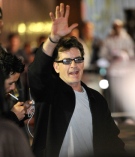 Charlie Sheen waves to fans as he leaves the Chicago Theatre, Sunday, April 3, 2011. (AP / Brian Kersey)