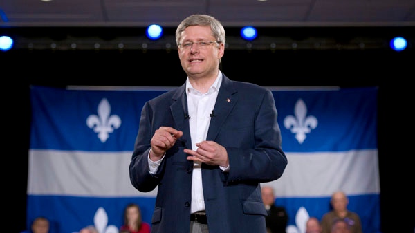 Prime Minister Stephen Harper delivers a speech during a campaign rally in Saint-Agapit, Quebec on Tuesday, April 5, 2011. THE CANADIAN PRESS/Sean Kilpatrick