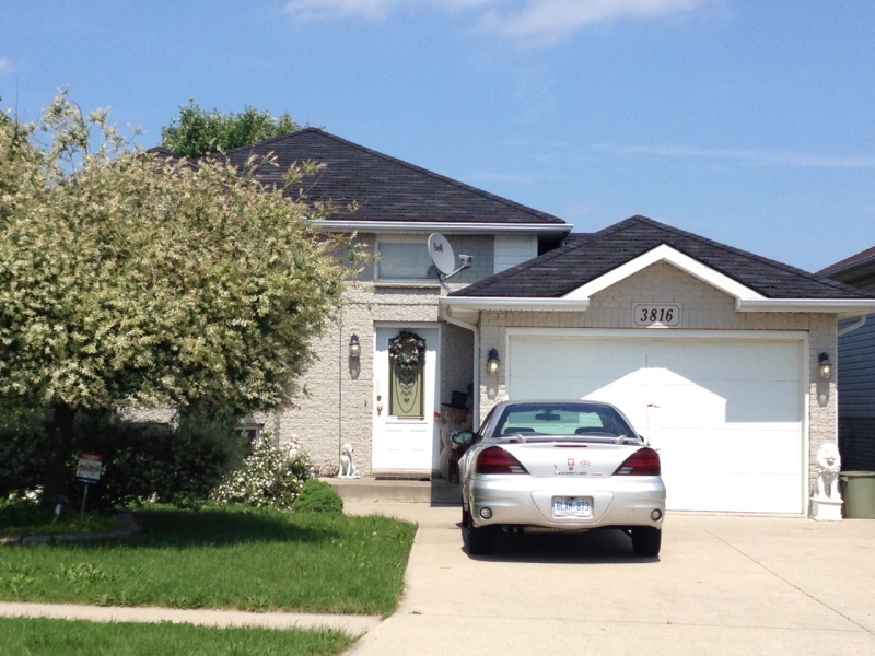 Windsor police are investigating a stabbing at this home on McGuire Street in Windsor, Ont., June 11, 2013. (Gina Chung / CTV Windsor)