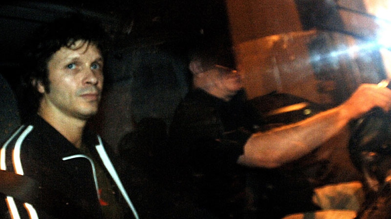 Bertrand Cantat, left, the French rock star convicted of manslaughter for beating his actress girlfriend to death, sits in a car as he is released from a prison early Tuesday, Oct. 16, 2007 near Toulouse, southwestern France. (AP Photo/Remy Gabalda)