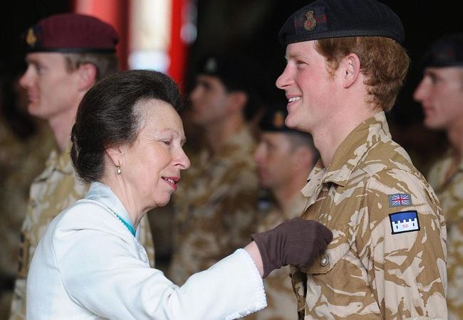 Princess Anne presents Prince Harry with his campaign medal, in Windsor, England on Monday, May 5, 2008. (AP / John Stillwell)