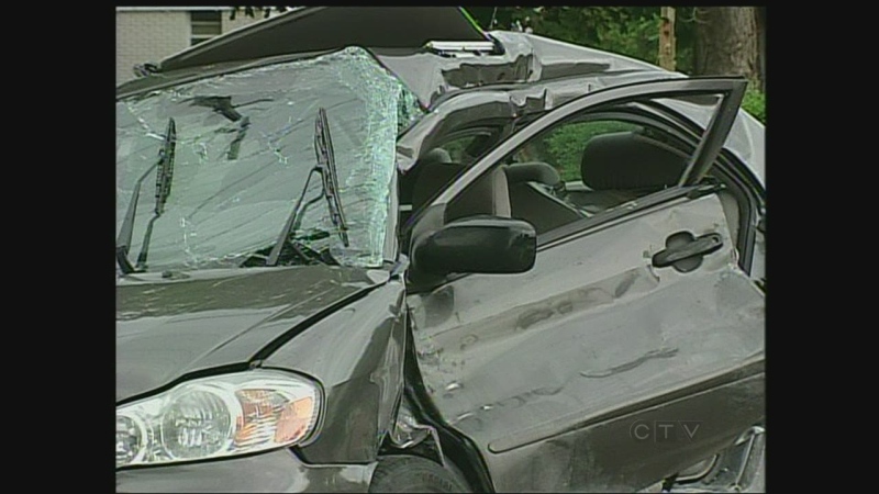 A woman had to be cut from her car after a crash with a gravel truck in Appin, Ont. on Wednesday, June 12, 2013.