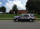 London police investigate at Sir George Cartier Public School after a female student was allegedly assaulted by a masked male in London, Ont. on Thursday, June 13, 2013. (Nick Paparella / CTV London)