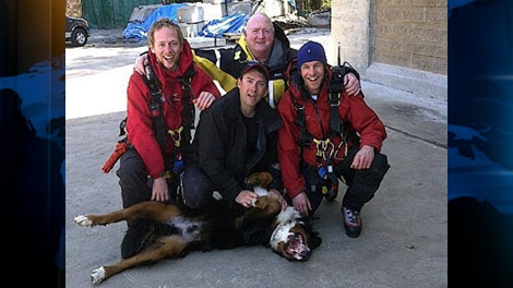 North Shore Rescue members pose with Hurley after they rescued him from a mountainous area in North Vancouver, B.C., on April 7, 2011. (CTV)