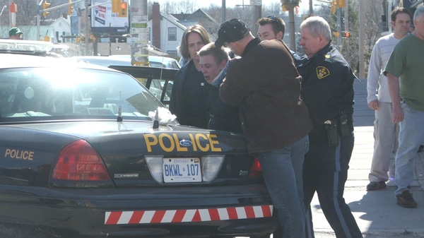 A business owner captured this photo of an arrest outside Clancy's Drug Store in Arnprior, Thursday, April 7, 2011. Viewer photo submitted by: Douglas Smith