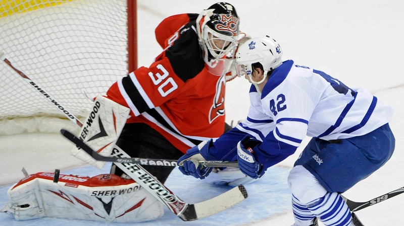 Toronto Maple Leafs' Tyler Bozak scores a short-handed goal against New Jersey Devils goaltender Martin Brodeur during the third period of an NHL hockey game on Wednesday, April 6, 2011, in Newark, N.J. The Devils defeated the Maple Leafs 4-2. (AP / Bill Kostroun)