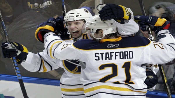 Buffalo Sabres' Thomas Vanek, left, of Austria, celebrates his goal with teammate Drew Stafford (21) in overtime of an NHL hockey game against the Philadelphia Flyers in Buffalo, N.Y., Friday, April 8, 2011. The Sabres won 4-3. (AP Photo/David Duprey)