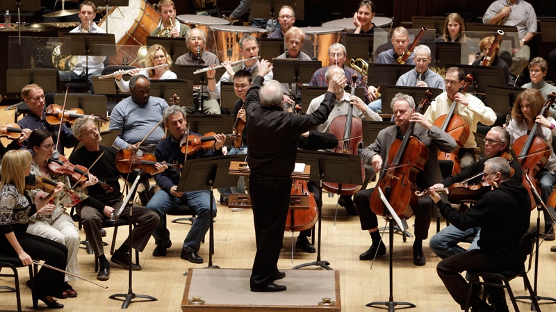 Detroit Symphony Orchestra Musical Director Leonard Slatkin leads the orchestra during a rehearsal in Detroit, Thursday, April 7, 2011. (AP / Carlos Osorio)