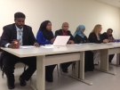 Members of the Somali community are shown during a press conference held to criticize police for their actions during a series of early-morning raids on June 13. (Matt Reid/CP24.com)
