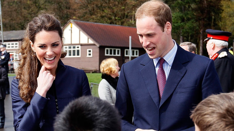 Prince William and Kate Middleton talk to youngsters from a local soccer club at Witton County Park, Darwen, near Blackburn, England Monday, April, 11, 2011.  (AP Photo/Alastair Grant)