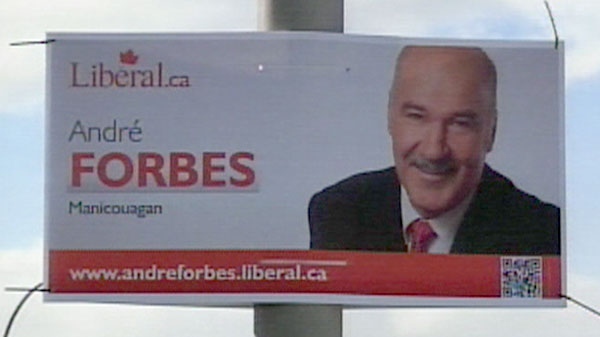 A campaign sign for Liberal candidate Andre Forbes is seen hanging on lamp post.