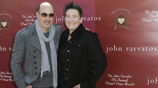 John Varvatos, at left, and K.D. Lang arrive at the John Varvatos 8th Annual Stuart House Benefit on Sunday March 13, 2011, in Los Angeles. ( THE ASSOCIATED PRESS / Katy Winn)