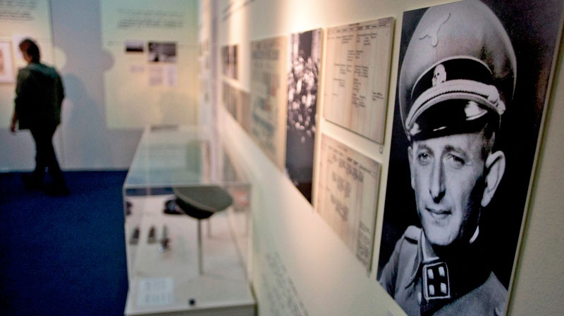 A visitor looks at an exhibition marking the 50th anniversary of Adolf Eichmann's trial in Jerusalem, Sunday, April 10, 2011. (AP / Sebastian Scheiner)