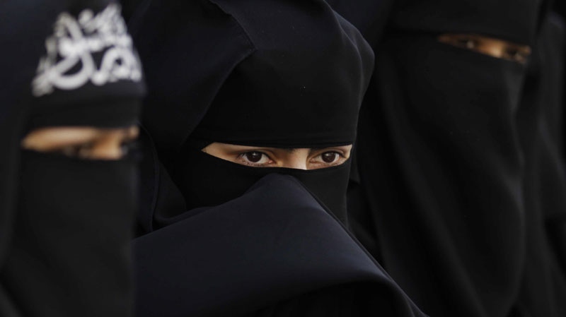 Veiled muslim women take part in protest in London, against France banning the wearing of Islamic veils in public, Monday, April 11, 2011. (AP Photo/Matt Dunham)