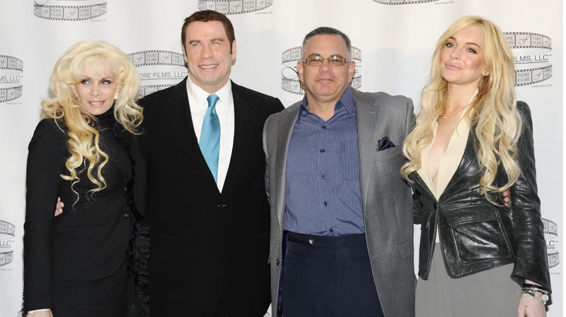 Victoria Gotti, author and daughter of the late John Gotti, left, actor John Travolta, John Gotti Jr. and actress Lindsay Lohan pose during a news conference for the film "Gotti: Three Generations."