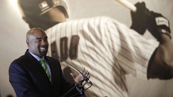 Former baseball player Carlos Delgado, of Puerto Rico, speaks to journalists after announcing his retirement in San Juan, Puerto Rico, Wednesday April 13, 2011. (AP Photo/Ricardo Arduengo)