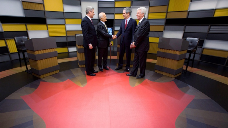 Stephen Harper, Jack Layton, Michael Ignatieff and Gilles Duceppe exchange handshakes as they arrive to the English language federal election debate in Ottawa, Tuesday, April 12, 2011. (Adrian Wyld / THE CANADIAN PRESS)  