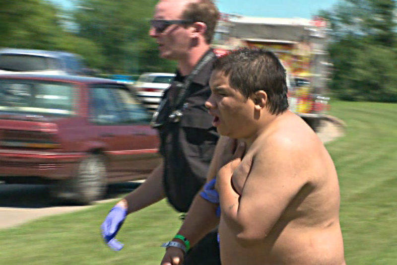This unidentified man was pulled from the river by police officers after jumping off the train bridge on Friday.