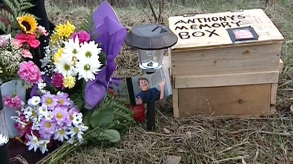 Anthony McColl, 19, is seen in a photograph placed at his makeshift memorial on the side of Highway 148 in Luskville, Que. McColl was killed in a head-on crash, Saturday, April 16, 2011.