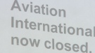 A closed sign hangs on the door of Aviation International in Guelph, Ont. on Monday, April 18, 2011.