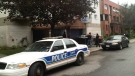 An Ottawa police cruiser is captured at the scene of what police call a "sudden death" incident after a man in his early 30s fell from a balcony Tuesday, July 2, 2013.
