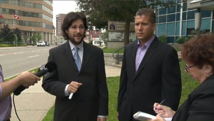Matthew Waltenberry (right) and lawyer Davin Charney speak to media on Wednesday, July 3, 2013.